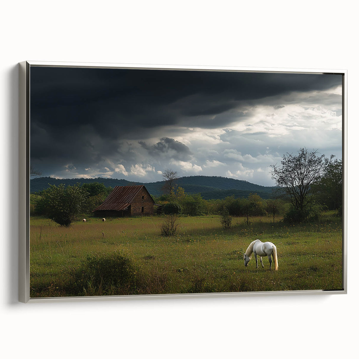 Framed canvas artwork depicting a serene countryside landscape with lush greenery and rolling hills, elegantly bordered in silver, perfect for home decor.