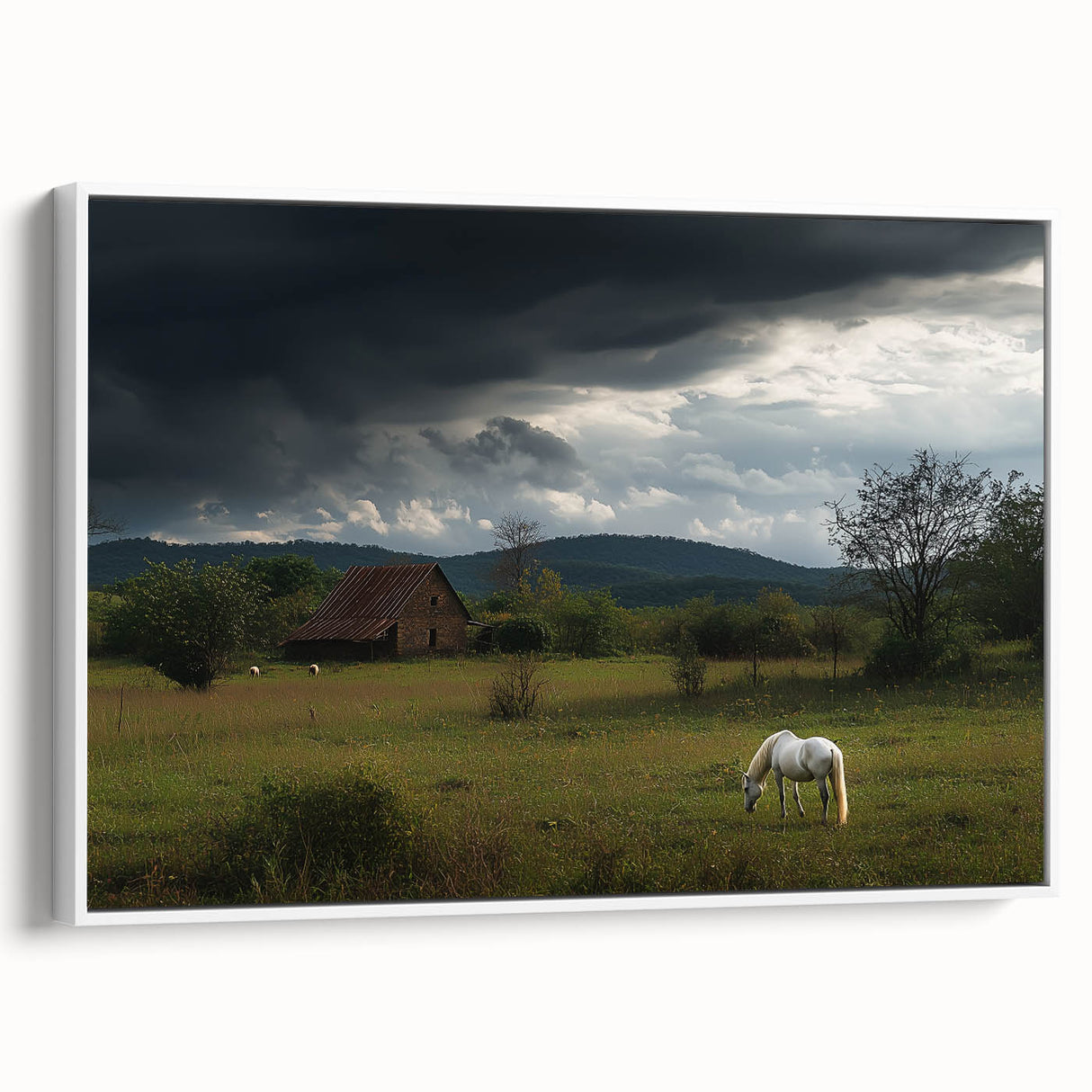Framed canvas artwork depicting a serene countryside landscape with rolling hills and a clear blue sky, showcased from a side angle on a white wall. This piece adds a tranquil touch to home decor.
