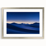 Framed desert landscape artwork with a silver mat, showcasing vibrant hues of orange and blue, adding a serene touch to home decor. Perfect for nature lovers.