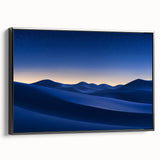 Framed canvas artwork showcasing a serene desert landscape with warm earth tones, featuring a sleek black frame and side view display for elegant decor.