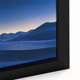 Close-up of a framed desert landscape canvas featuring vibrant oranges and browns, showcasing dramatic rock formations and a serene sky, perfect for home decor.