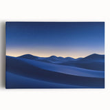 Stretched canvas artwork depicting a vibrant desert landscape with warm colors, featuring rolling sand dunes and a clear blue sky, perfect for home decor.