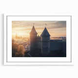 Elegant landscape print of a medieval castle framed with a white mat, showcasing intricate architectural details and lush surroundings, perfect for home decor.