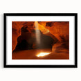 Framed landscape artwork depicting a serene cave scene, featuring a black matting around the image, ideal for home decor or office settings. Perfect for nature enthusiasts and art lovers.