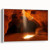 Framed canvas artwork depicting a serene landscape with intricate cave formations, presented in a sleek white frame, ideal for enhancing modern home décor.