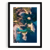 Black-framed landscape artwork featuring dramatic cliffs and vibrant colors, elegantly matted to enhance its visual appeal, perfect for home decor.