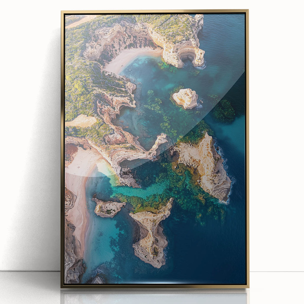 Framed acrylic artwork showcasing a breathtaking landscape of rugged cliffs against a vibrant sunset, with a gold frame enhancing its elegance, perfect for home decor.
