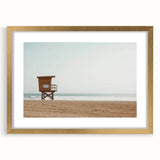 Elegant landscape framed print showcasing a serene beach scene with golden matting, ideal for enhancing home decor and evoking a sense of tranquility.