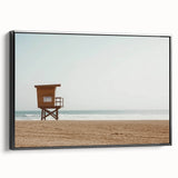Framed canvas artwork showcasing a stunning beach landscape with vibrant colors and intricate details, presented in a sleek black frame, perfect for home decor.
