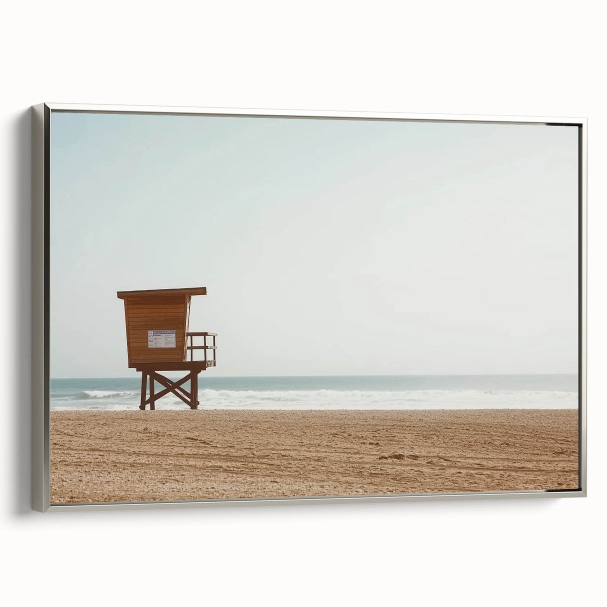 Framed canvas artwork depicting a serene beach landscape with vibrant colors and a silver frame, ideal for enhancing coastal-themed decor and creating a calming atmosphere.
