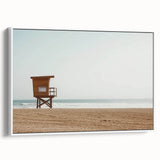 Framed canvas artwork depicting a serene beach landscape with vibrant colors, showcasing gentle waves and a clear sky, presented in a sleek white frame. Ideal for modern home decor.