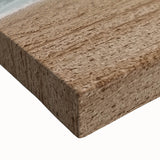 Close-up of a stretched canvas artwork depicting a serene beach landscape with vibrant blue skies and soft white clouds, ideal for enhancing home decor.