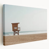 Stretched canvas artwork depicting a serene beach landscape in vibrant colors, showcasing gentle waves and a clear sky, ideal for coastal-themed decor.