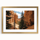 Elegant gold-framed landscape print depicting majestic canyons, featuring a soft mat border for added depth and style, perfect for home décor or art enthusiasts.