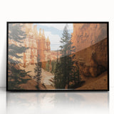 Framed acrylic artwork showcasing a stunning landscape of canyons in rich earthy tones, featuring a sleek black frame that enhances the dramatic scenery. Perfect for modern decor.