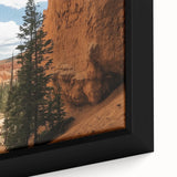 Close-up of a framed landscape canvas depicting vibrant canyons with rich colors and intricate details, ideal for home decor enthusiasts seeking natural beauty.