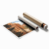 Landscape canyons rolled print showcasing vibrant hues of orange and blue, depicting dramatic rock formations under a clear sky, presented in a protective cardboard tube.