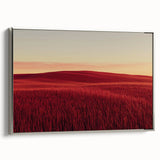 Framed canvas artwork depicting a serene countryside landscape with vibrant green fields and a clear blue sky, showcased in a sleek silver frame for an elegant touch.