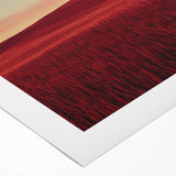 Rolled canvas artwork depicting a serene countryside landscape with lush green fields and rolling hills, elegantly packaged in a protective cardboard tube for safe shipping.