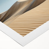 Desert landscape rolled canvas print showcasing vibrant hues of orange and blue, featuring a stunning sunset over sand dunes, ideal for home decor.