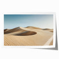 Desert landscape rolled print showcasing vibrant hues of orange and yellow, capturing the serene beauty of a sunset over dunes, ideal for home decor.