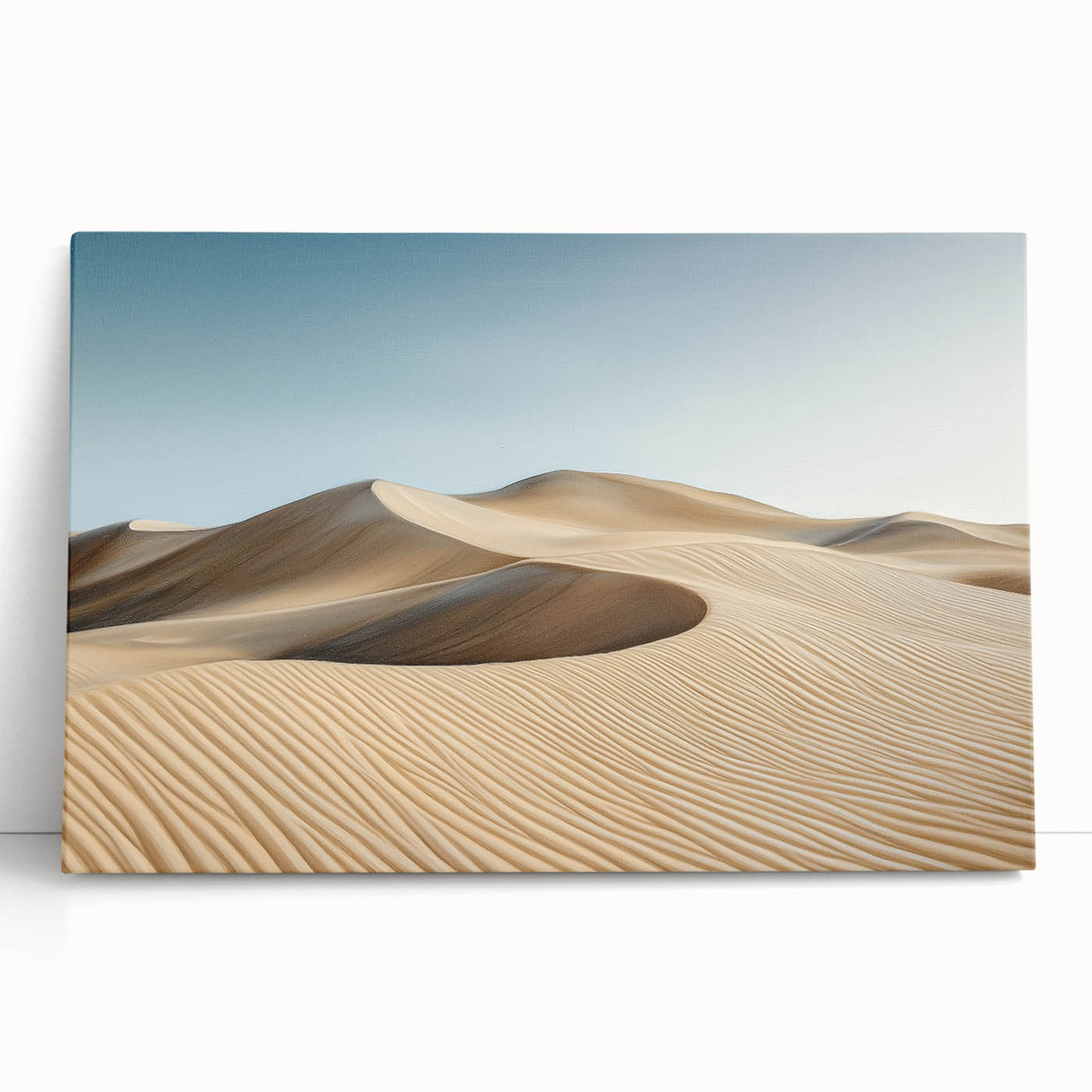 Vibrant stretched canvas artwork depicting a serene desert landscape with warm, earthy tones, leaning against a neutral wall, perfect for home decor.