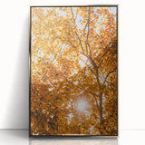 Mid-century modernist art depicting fall seasons in muted orange and brown tones, framed in silver acrylic.