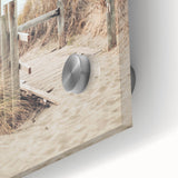 Large abstract wall art in vibrant orange and blue tones on acrylic glass.