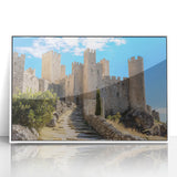 Framed acrylic artwork showcasing a picturesque landscape with a majestic castle, set against a serene blue sky, ideal for home decor enthusiasts.