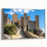Framed canvas artwork showcasing a picturesque landscape with a majestic castle, featuring a silver border, ideal for enhancing home decor with elegance and charm.
