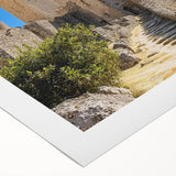 Rolled canvas print showcasing a picturesque landscape featuring a majestic castle surrounded by lush greenery, ideal for home decor. Perfect for art enthusiasts and interior designers seeking a classic touch.