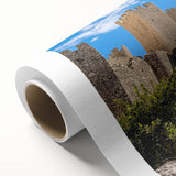 Vibrant rolled canvas depicting a stunning landscape with majestic castles against a serene sky, showcasing rich colors and intricate details, perfect for home decor.