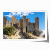 Rolled print showcasing a vibrant landscape featuring a majestic castle surrounded by lush greenery, designed for home décor, and packaged securely in a cardboard tube.