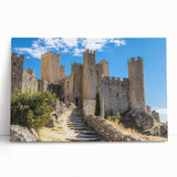 Stretched canvas artwork depicting a serene landscape with a majestic castle surrounded by lush greenery and a vibrant sky, perfect for home decor enthusiasts.