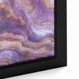 Close-up of a beautifully framed canvas depicting a dramatic landscape of cliffs with vibrant colors and intricate details, perfect for home decor.