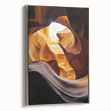 Framed canvas artwork depicting a stunning landscape of canyons with rich earth tones and silver frame accents, perfect for enhancing modern decor aesthetics.