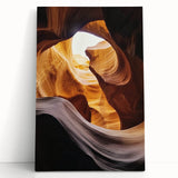 Stretched canvas artwork depicting a vibrant landscape of canyons at sunset, featuring rich orange and purple hues. Ideal for home decor and nature enthusiasts.