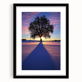 Black-framed landscape art print showcasing a serene countryside scene with vibrant greenery and rolling hills, accented by a white mat, ideal for home decor.