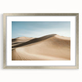 Framed silver landscape artwork depicting a serene desert scene with soft hues and intricate details, elegantly matted for a polished presentation. Perfect for home decor.
