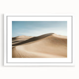 Desert landscape artwork framed in white matting, showcasing warm beige and sandy tones, perfect for enhancing modern home décor with a tranquil aesthetic.