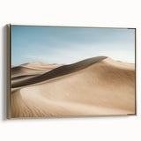 Framed canvas artwork showcasing a stunning desert landscape with warm gold tones, elegantly displayed from a side view, perfect for home decor.