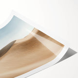 Desert landscape rolled canvas print showcasing vibrant orange and yellow hues, depicting a serene sunset over sand dunes, ideal for home decor.