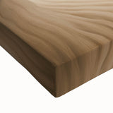 Close-up of a stretched canvas print depicting a vibrant desert landscape with warm tones of orange and yellow, highlighting the intricate details of the artwork. Ideal for home decor, this piece captures the serene beauty of arid environments, enhancing any room's aesthetic.