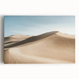 Vibrant desert landscape stretched canvas artwork showcasing rich hues of orange and blue with a dramatic sunset, ideal for modern home decor and art enthusiasts.