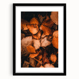 Extra large abstract art print featuring textured fall foliage in vibrant orange and yellow hues, framed in black.