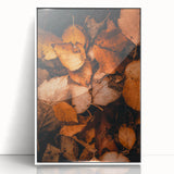 Art deco poster featuring autumnal trees in muted orange and brown tones, framed in white acrylic.