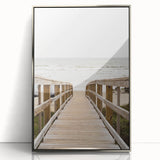 Mid-century modernist art featuring abstract geometric shapes in pastel colors, framed in silver acrylic.