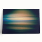 Abstract wall art featuring vibrant blue, yellow, and pink strokes on a stretched canvas, leaning against a neutral wall, adding a modern touch to home decor.