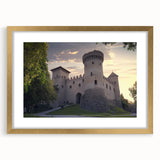 Elegant gold-framed landscape artwork depicting a serene castle scene, complete with a white mat, perfect for enhancing home decor with a touch of sophistication.