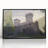 Framed acrylic artwork of a scenic landscape featuring a majestic castle, showcased in a sleek black frame, ideal for home decor and art collectors.